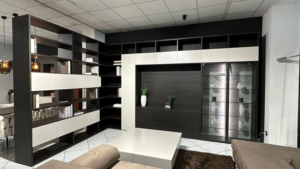 Parete Mood angolare con libreria bifacciale integrata